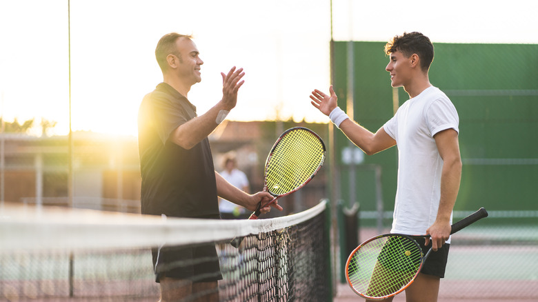 Two people playing tennis