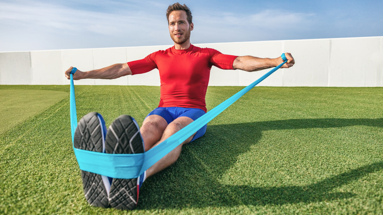 man using resistance bands