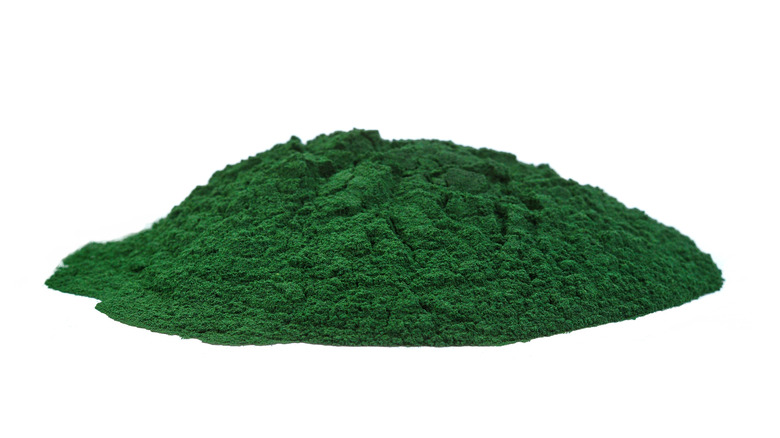 Spirulina powder against white background