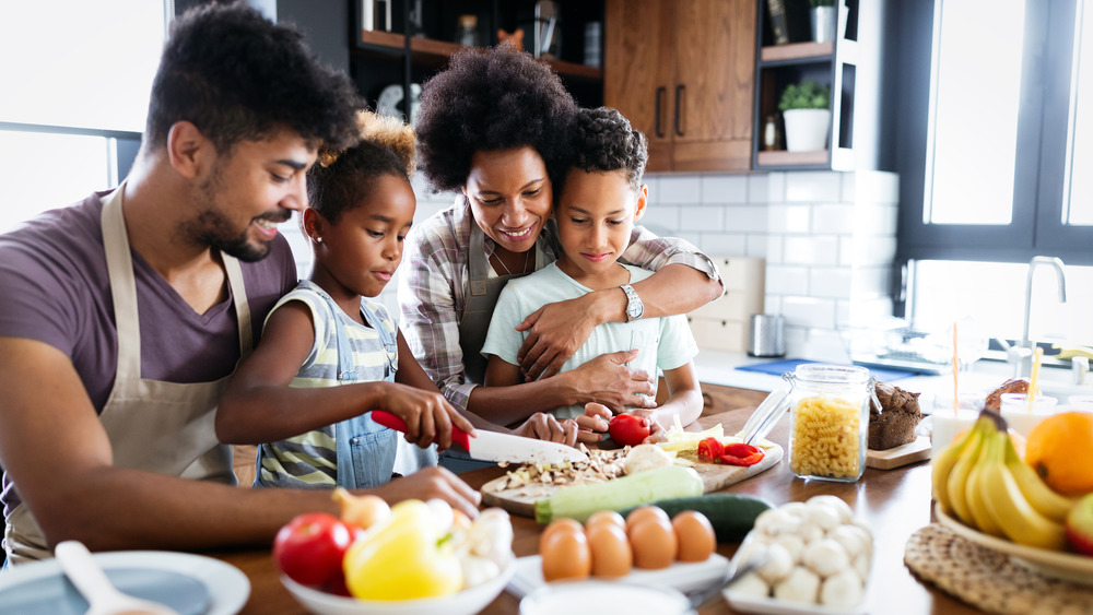 Family with children cooking together