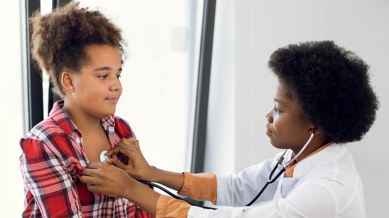 doctor performing auscultation