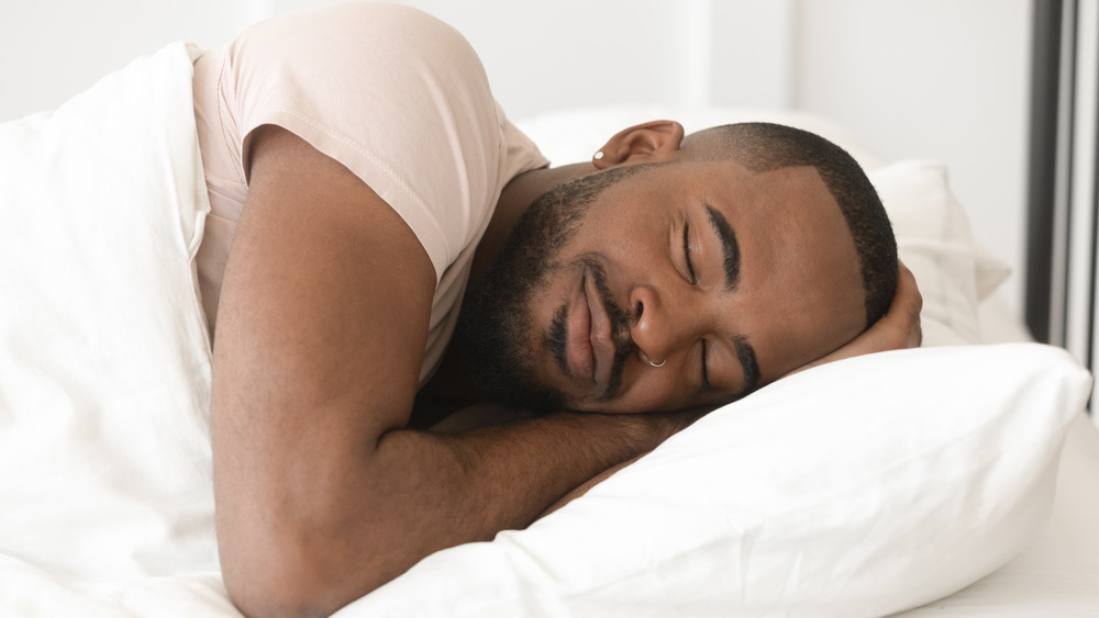 Man asleep peacefully in bed