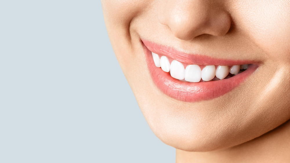 a close up of a woman's smile