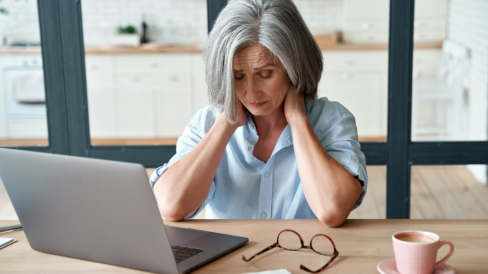 Older woman having tech issues