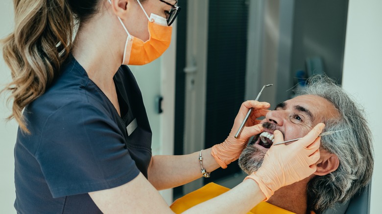 A man is at the dentist