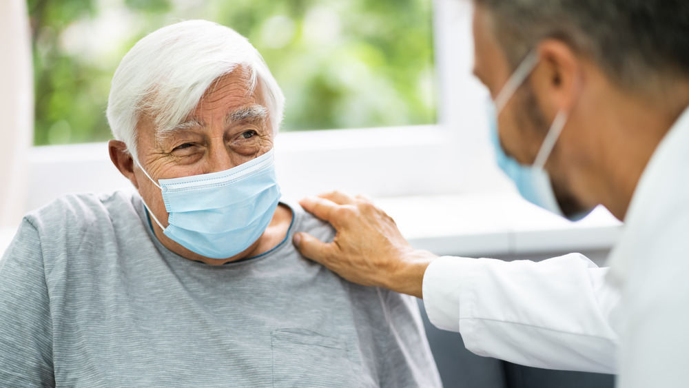 Elderly person wearing mask