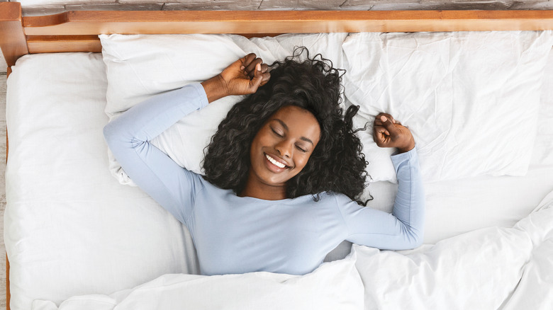 Woman sleeping alone happily