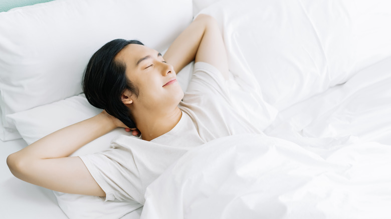 Man sleeping alone peacefully