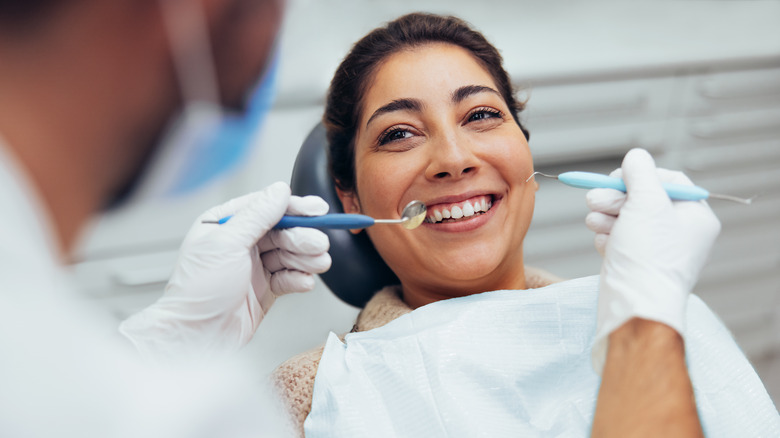 woman getting dental checkup 