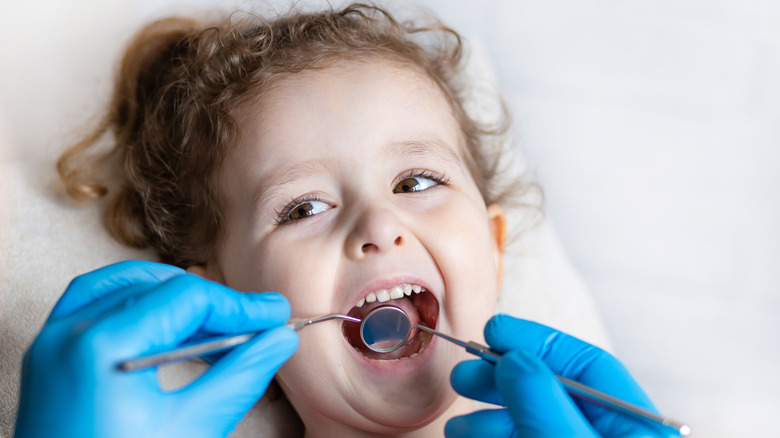Young girl at the dentist