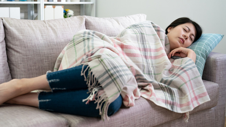 woman sleeping on couch