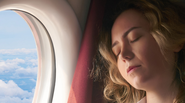 woman sleeping on a plane