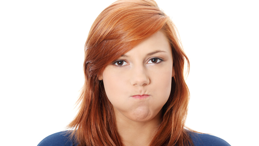 Woman holding her breath