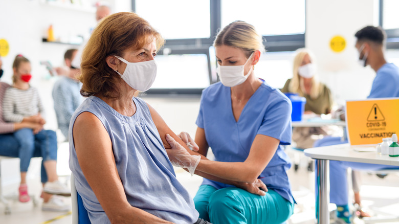 Woman getting COVID-19 vaccine