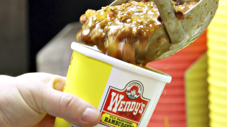 Wendy's chili being scooped into a container