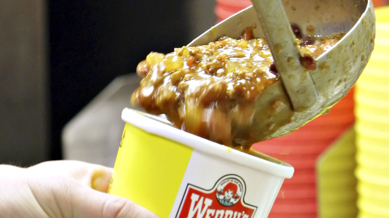 Wendy's chili being scooped into a container