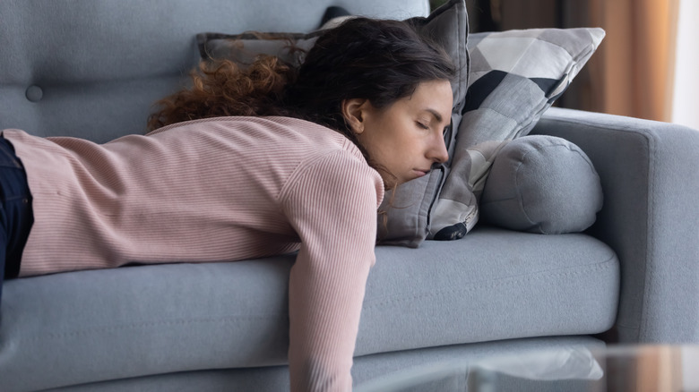 woman taking a nap on couch