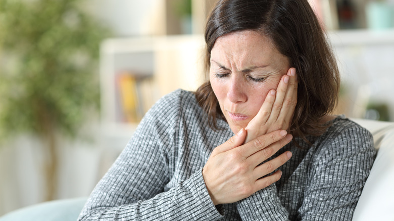 person with tooth pain