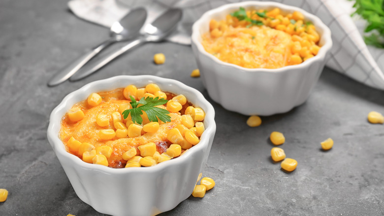 two ramekins of corn pudding on a table 