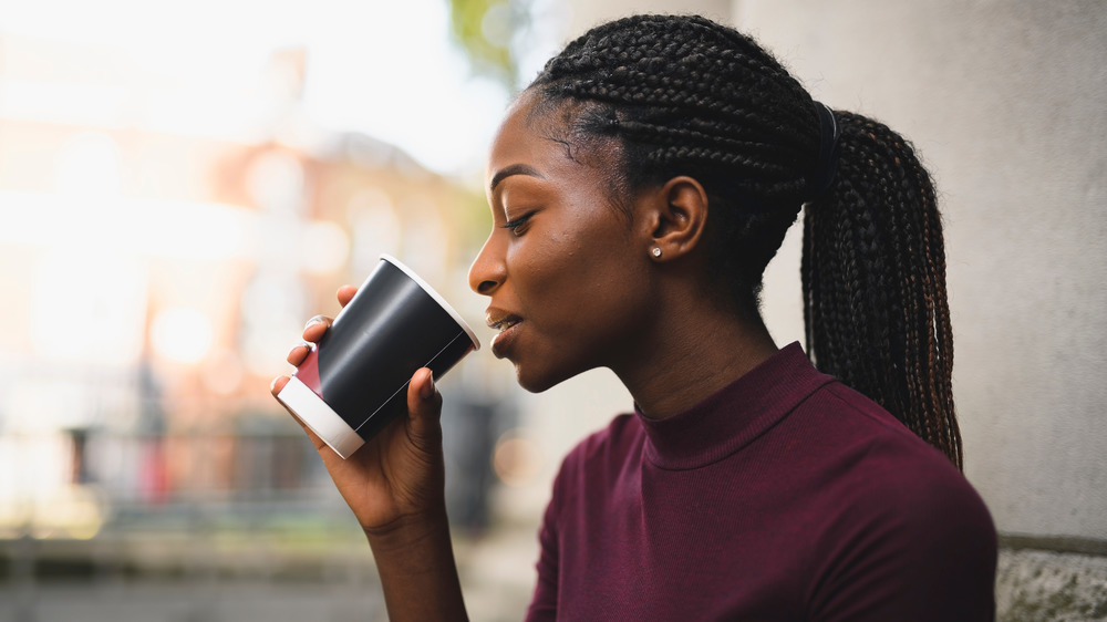 Woman drinking from a cup