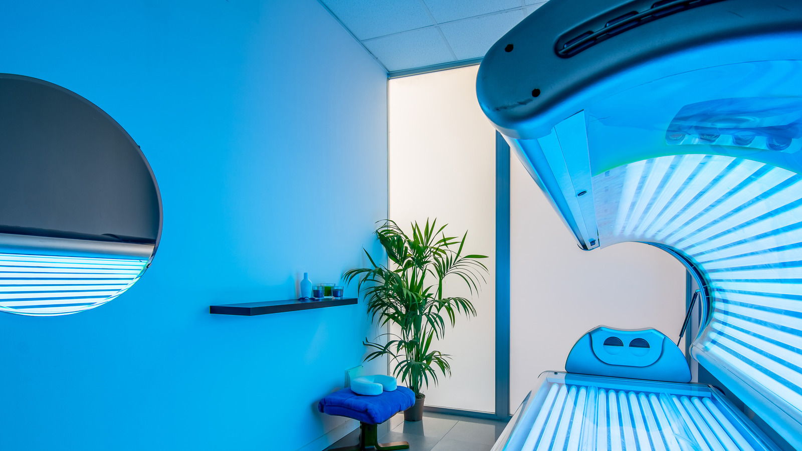 The Real Risk You're Taking When You Use A Tanning Bed