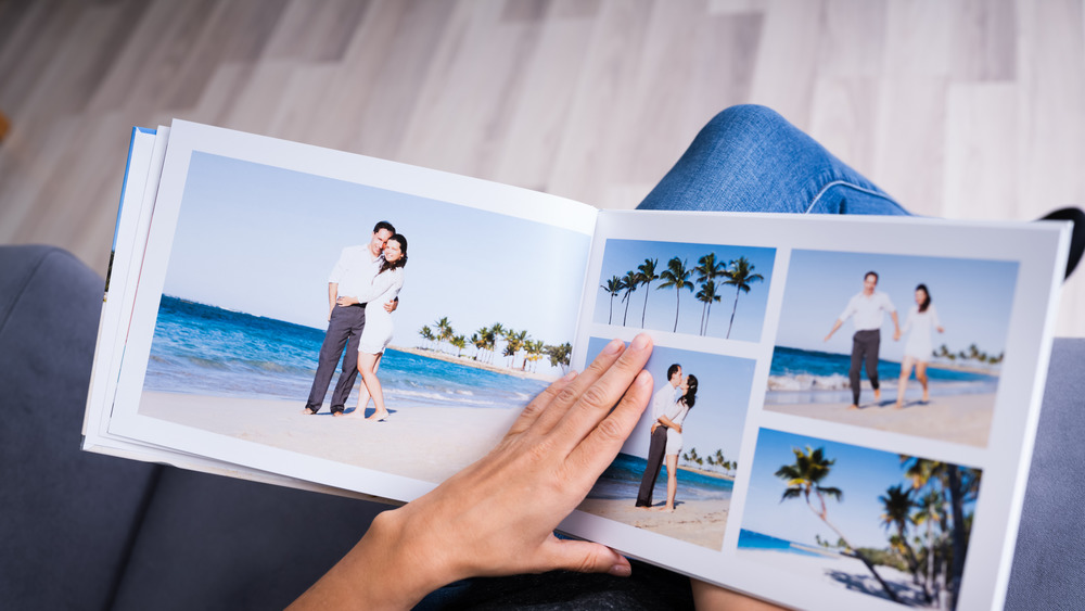Person looking at photo album on lap