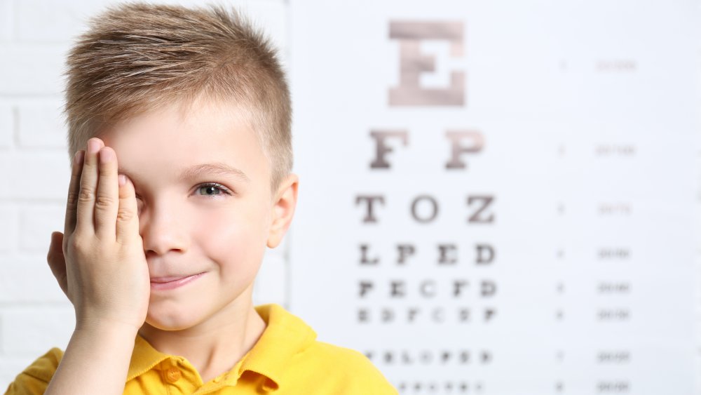 Boy taking eye exam