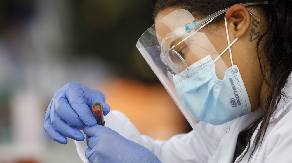 Doctor handling blood sample