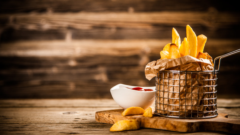basket of french fries with ketchup