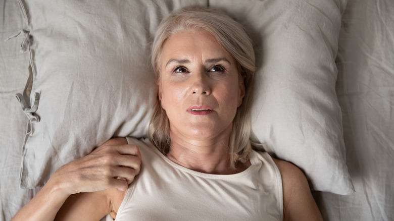 Woman laying in bed