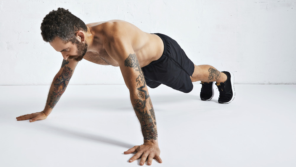 man doing wide pushup