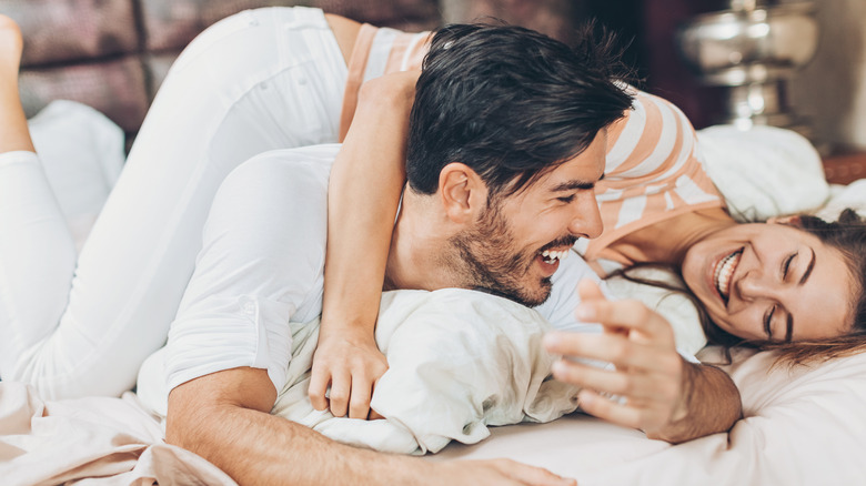 Couple on a hotel bed