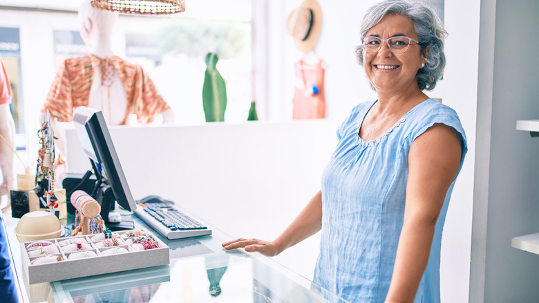 woman standing near register