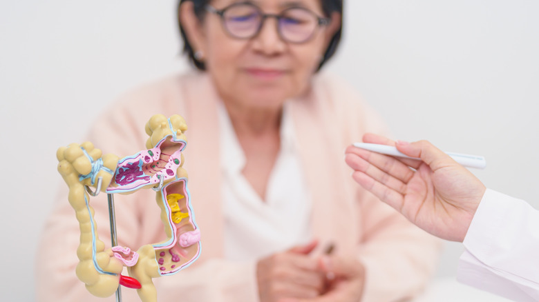 doctor talking about colon treatment with mature patient