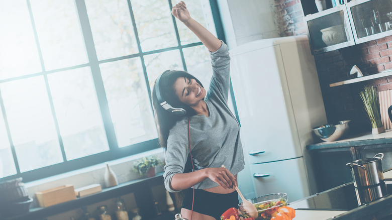 Woman cooking in underwear