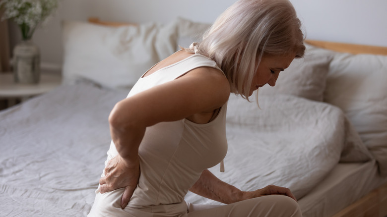 Woman with low back pain due to osteoporosis