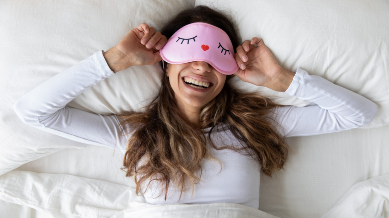 Woman wearing sleep mask