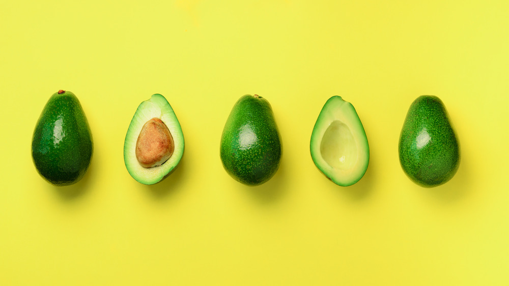 Avocados on a yellow background