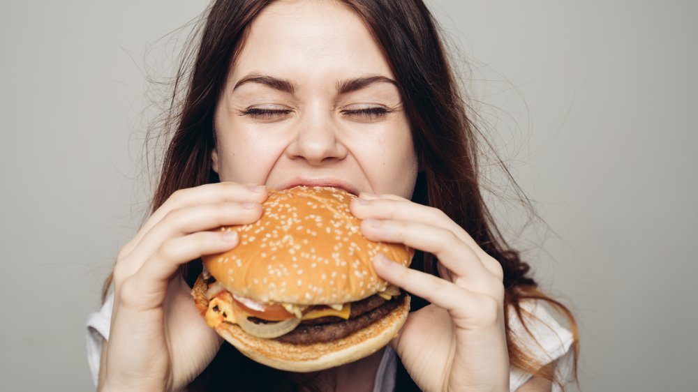 woman eating a burger