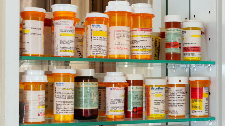 Prescriptions bottles in a medicine cabinet
