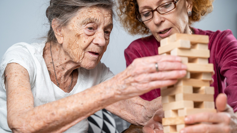 elderly woman with caregiver
