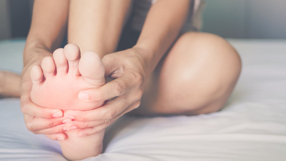 Person massaging foot