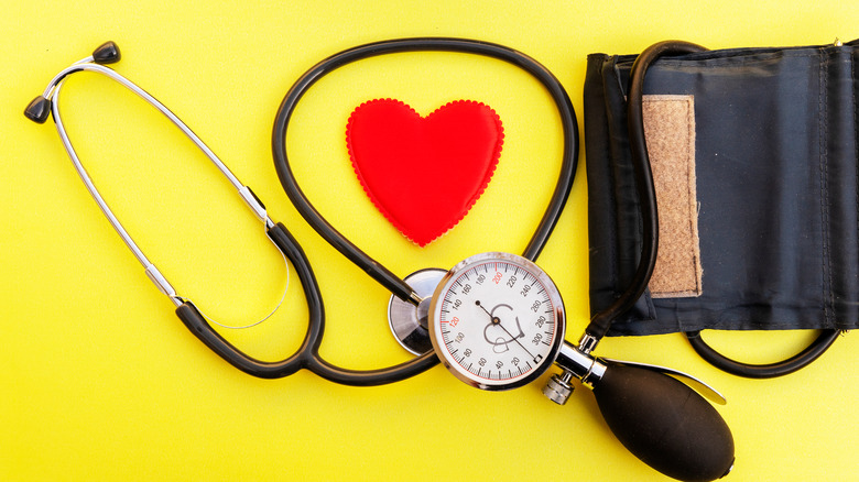 stethoscope and blood pressure with paper heart