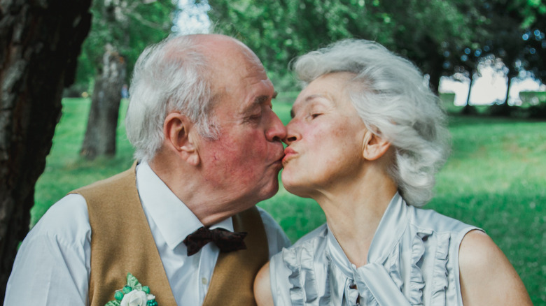 older couple kissing