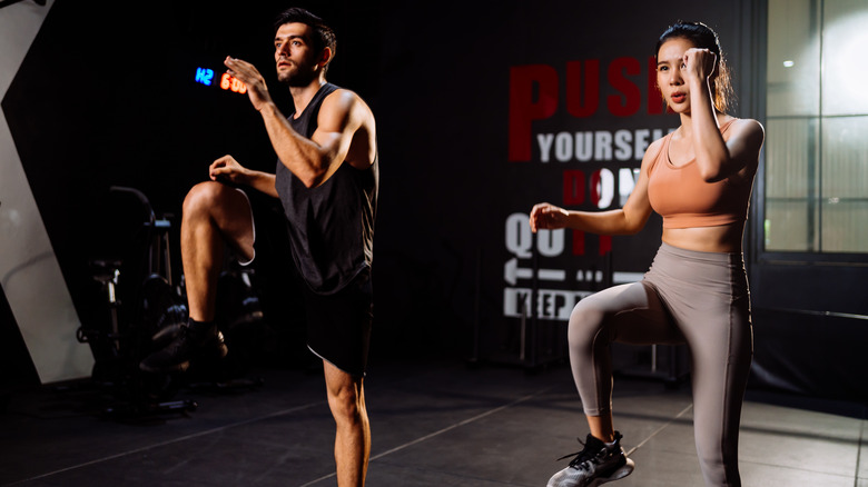 man and woman doing HIIT workout