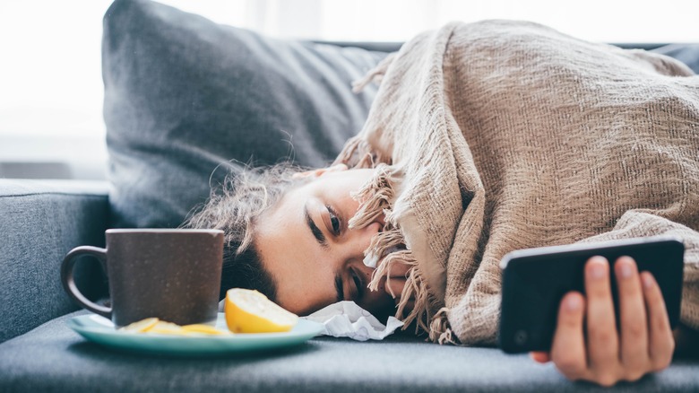 Woman laying on couch 