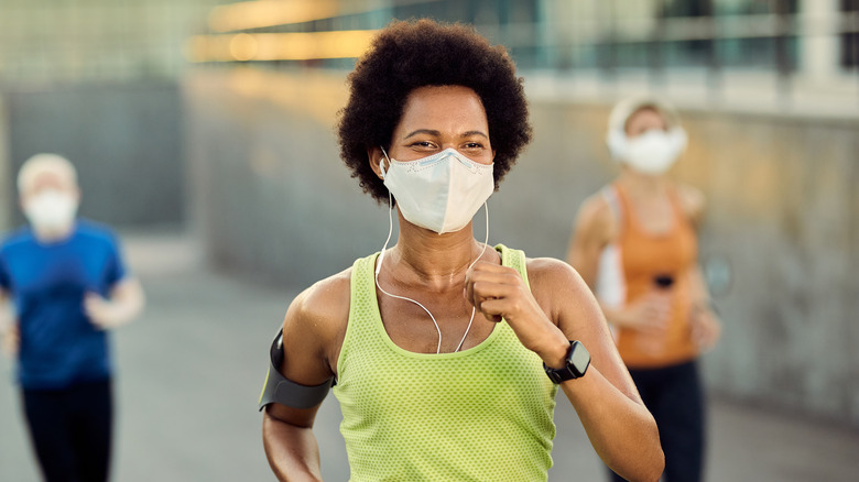 woman running in mask