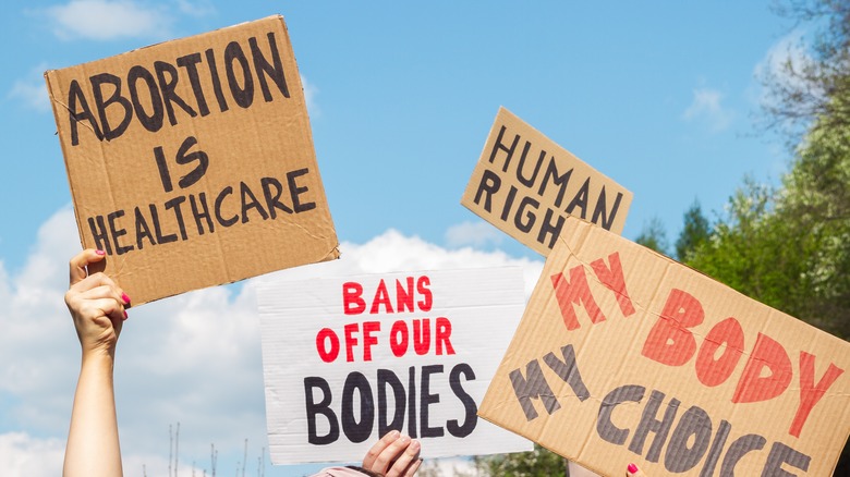 Pro-choice posters being held in the air