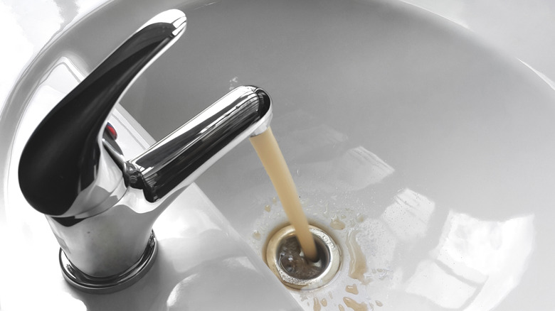 Yellow running tap water 