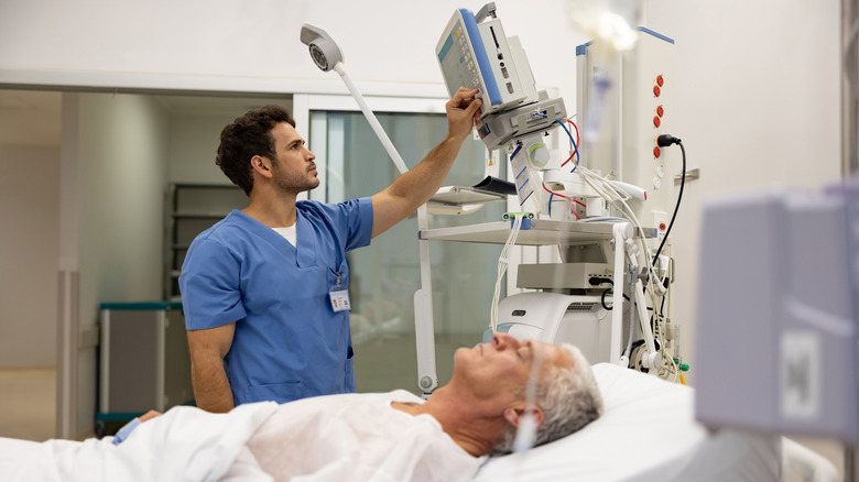 Nurse checking on hospitalized patient